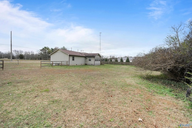 view of yard with a rural view