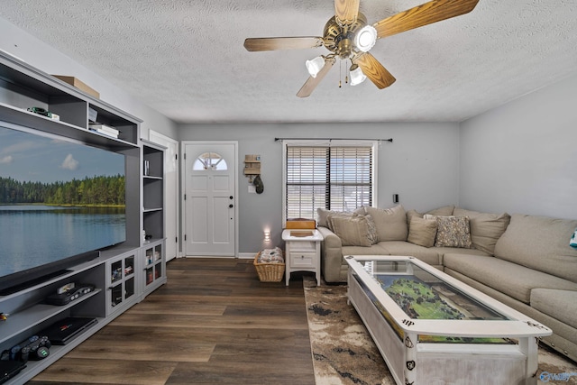 living room featuring a textured ceiling, dark hardwood / wood-style floors, and ceiling fan