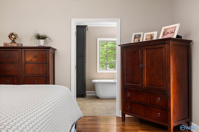 bedroom with hardwood / wood-style floors