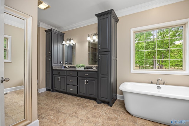 bathroom with tile patterned flooring, vanity, and plenty of natural light