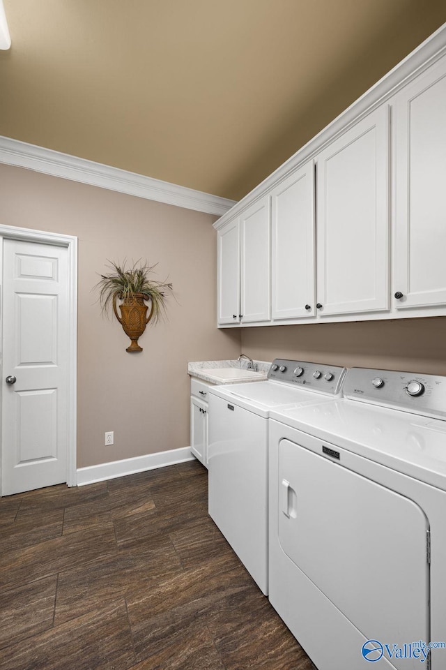 washroom with cabinets, dark hardwood / wood-style flooring, crown molding, and independent washer and dryer