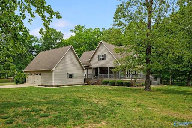 view of front of house with a garage, a porch, and a front lawn