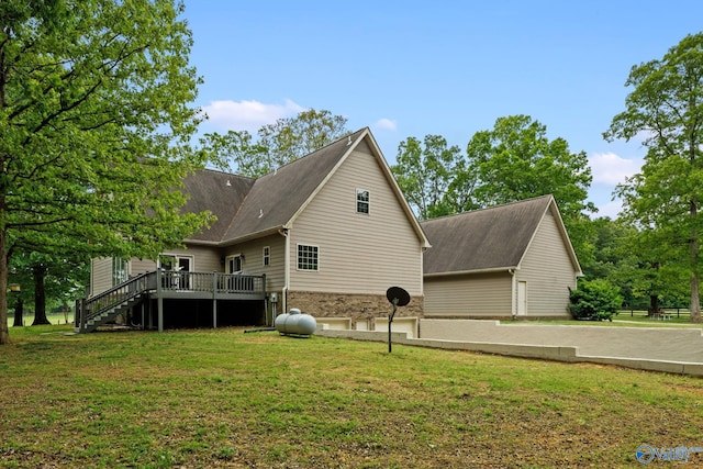 view of home's exterior featuring a deck and a lawn