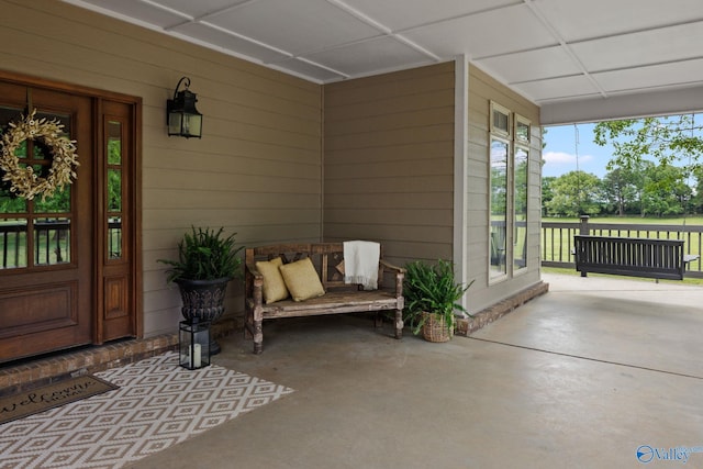 doorway to property featuring covered porch