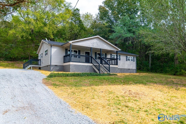 bungalow-style house with covered porch and a front yard