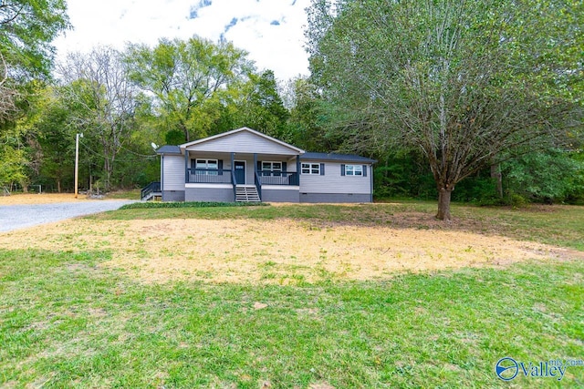 view of front of home featuring a front yard and a porch