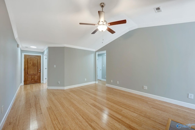 empty room featuring light wood-style flooring, visible vents, ceiling fan, and crown molding