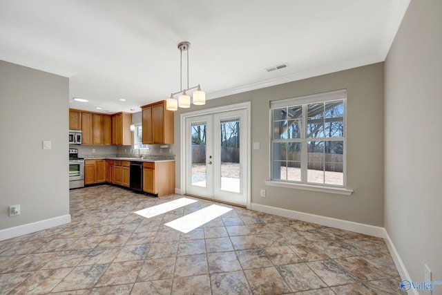 kitchen featuring visible vents, ornamental molding, a sink, light countertops, and appliances with stainless steel finishes