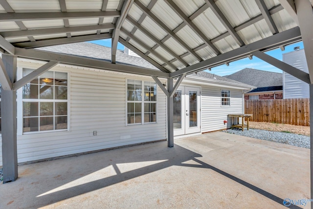 view of patio / terrace featuring french doors and fence