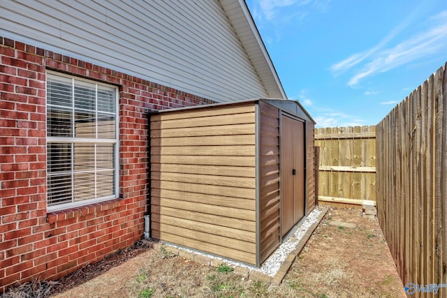 view of shed featuring a fenced backyard