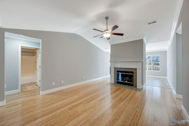 unfurnished living room featuring visible vents, light wood-style flooring, lofted ceiling, and a ceiling fan