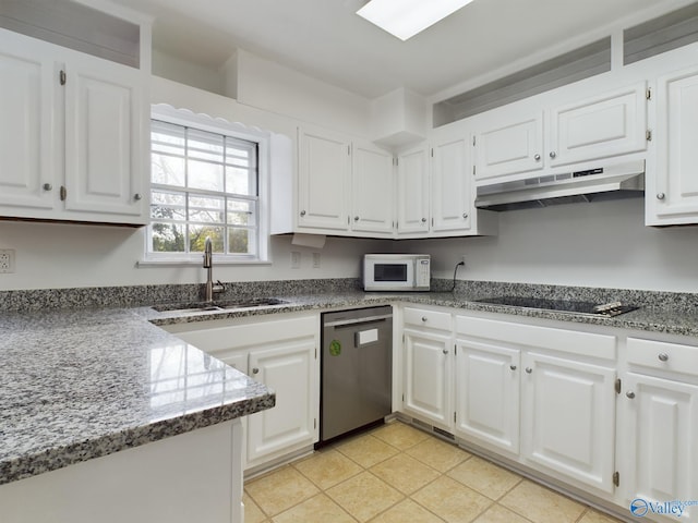 kitchen featuring black cooktop, dark stone counters, sink, white cabinets, and dishwasher