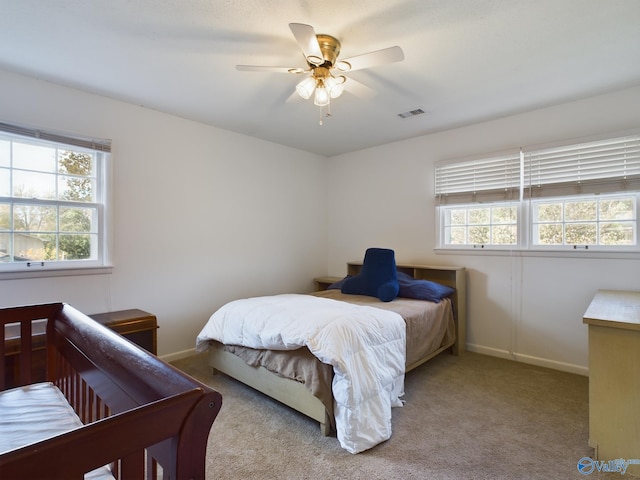 carpeted bedroom with ceiling fan