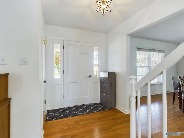 entryway with dark hardwood / wood-style floors