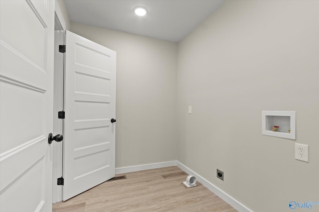 laundry room with washer hookup, light wood-type flooring, and electric dryer hookup