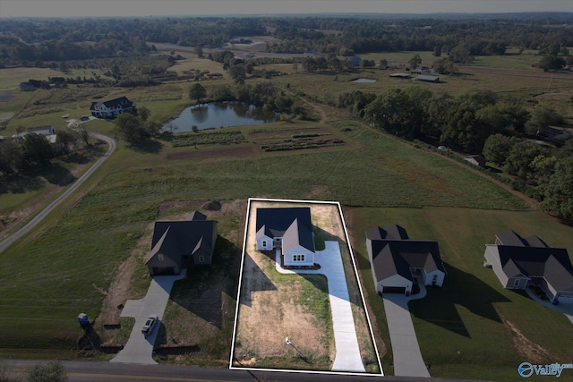 bird's eye view featuring a water view and a rural view