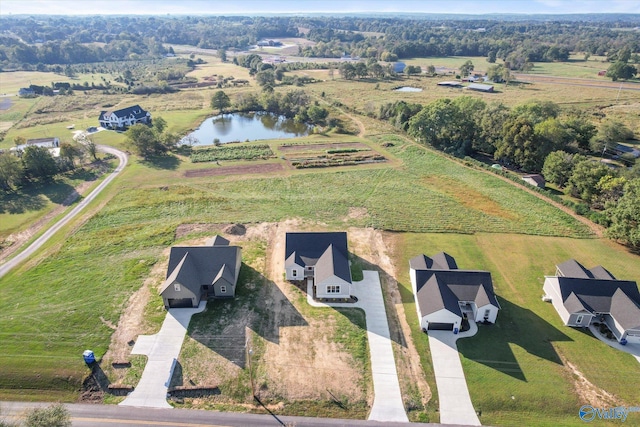 bird's eye view with a water view and a rural view