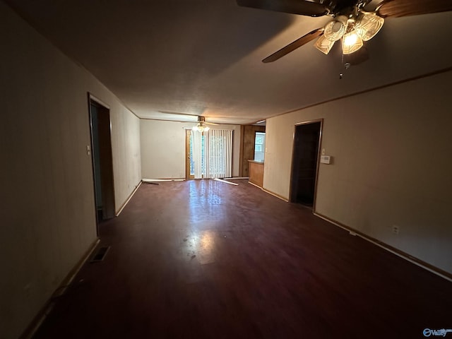 unfurnished room featuring a ceiling fan, visible vents, and wood finished floors