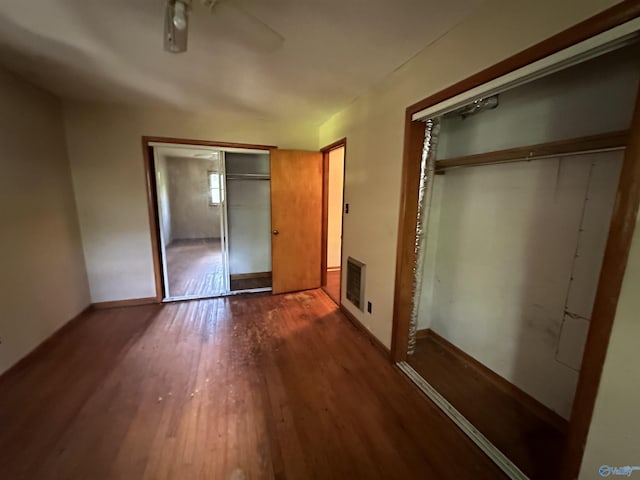 unfurnished bedroom with wood finished floors and a ceiling fan