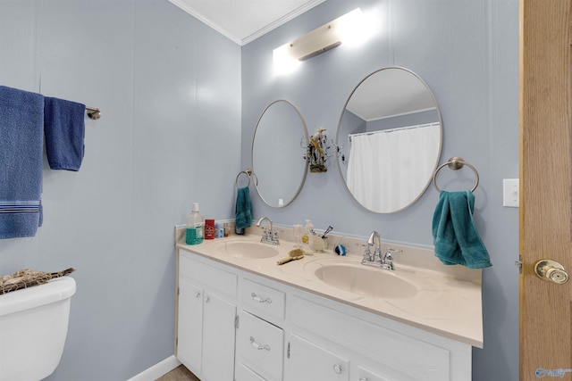 bathroom featuring toilet, vanity, crown molding, and a shower with curtain