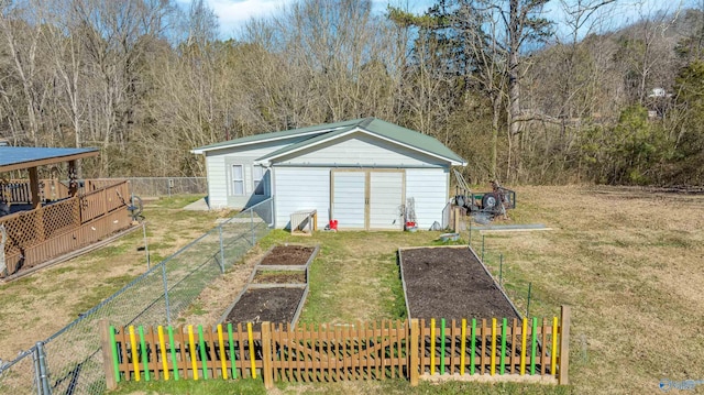 view of outbuilding featuring a lawn