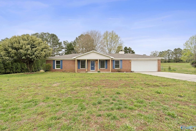 936 Toney Rd, Toney, AL 35773 - single story home with a front yard, a chimney, brick siding, concrete driveway, and an attached garage