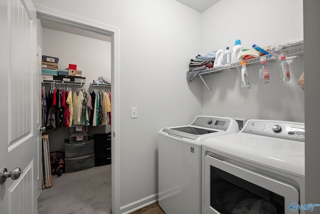 clothes washing area with carpet, washer and clothes dryer, and laundry area