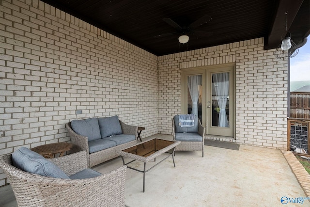 view of patio with an outdoor living space and a ceiling fan