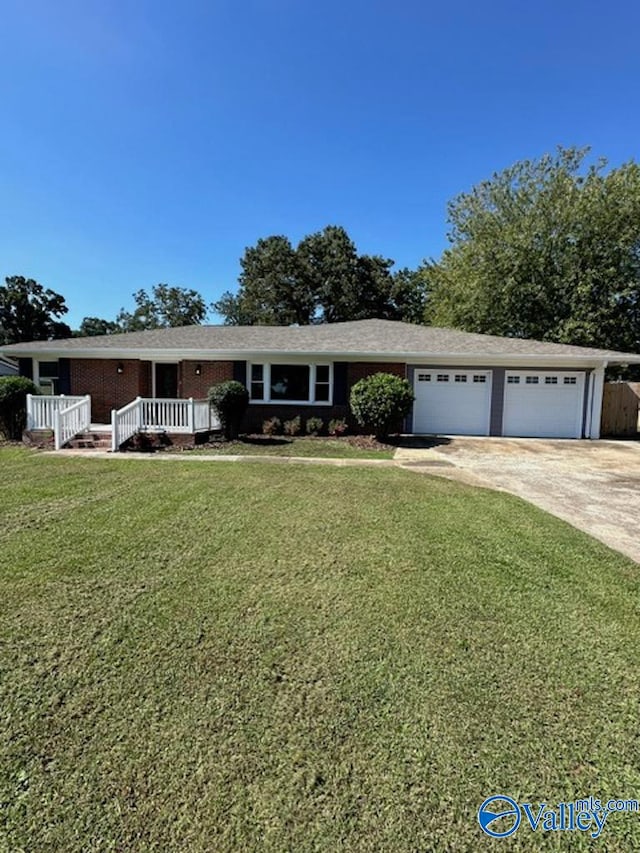 ranch-style house with a garage and a front lawn