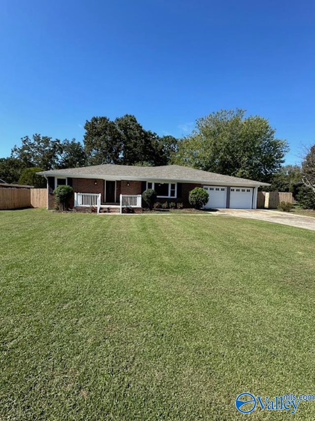 ranch-style house with a front yard and a garage