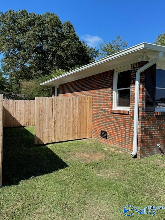 view of property exterior with a lawn