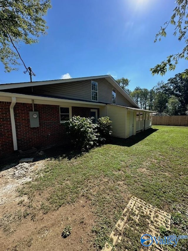 view of home's exterior featuring a lawn