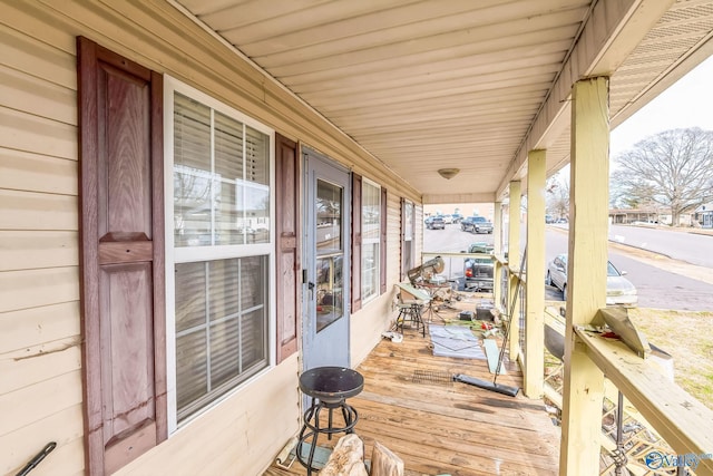 wooden terrace featuring a porch