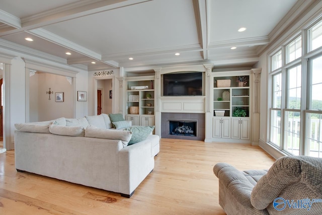 2602 Legacy Preserve Dr, Brownsboro, AL 35741 - living area featuring crown molding, coffered ceiling, a large fireplace, beamed ceiling, and light wood-style flooring
