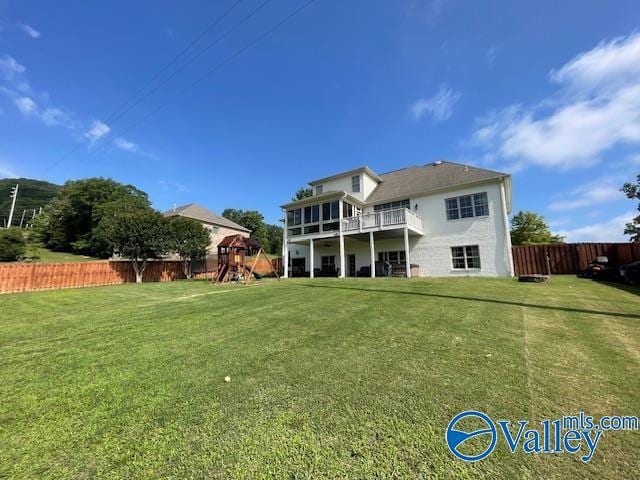 2602 Legacy Preserve Dr, Brownsboro, AL 35741 - rear view of property featuring a playground and a balcony