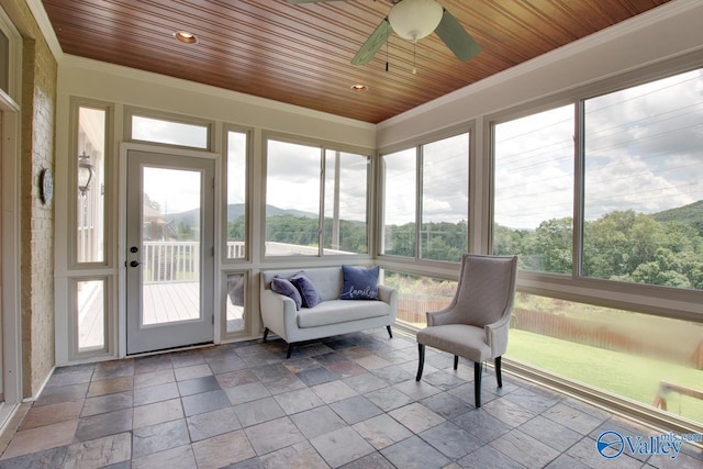 2602 Legacy Preserve Dr, Brownsboro, AL 35741 - sunroom featuring crown molding, stone tile floors, wooden ceiling, a ceiling fan, and a mountain view