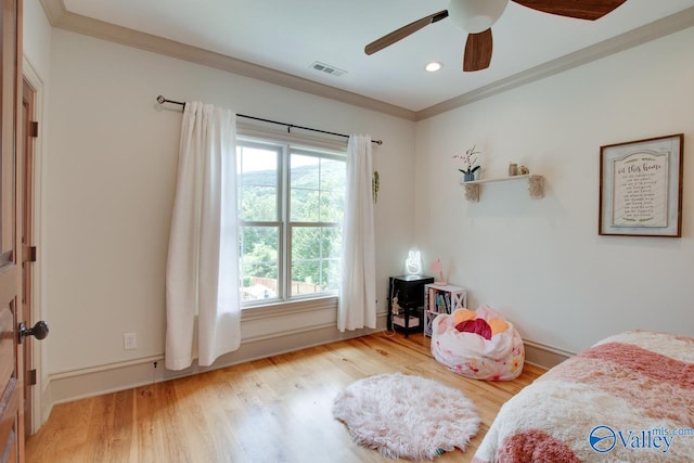 2602 Legacy Preserve Dr, Brownsboro, AL 35741 - bedroom featuring crown molding, wood finished floors, recessed lighting, a ceiling fan, and baseboards