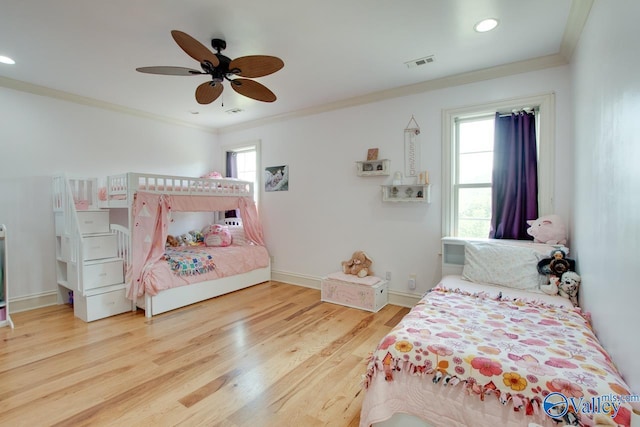 2602 Legacy Preserve Dr, Brownsboro, AL 35741 - bedroom featuring crown molding, wood finished floors, recessed lighting, ceiling fan, and baseboards