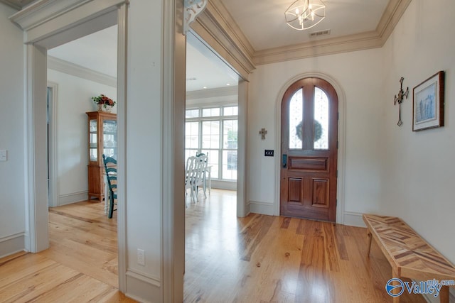 2602 Legacy Preserve Dr, Brownsboro, AL 35741 - entryway with light wood-style floors, ornamental molding, a chandelier, and baseboards