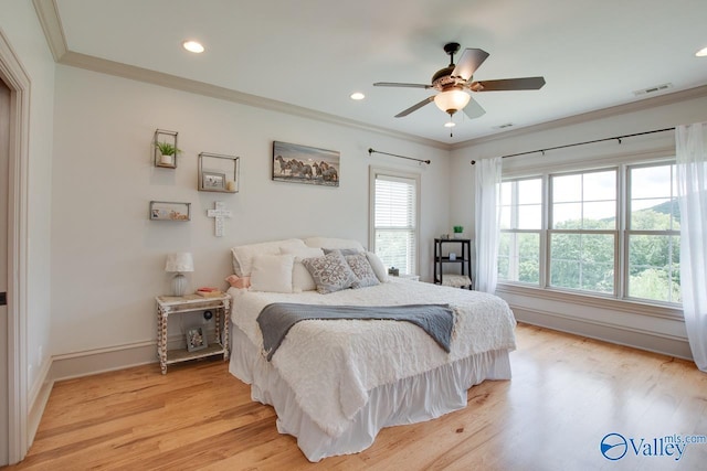 2602 Legacy Preserve Dr, Brownsboro, AL 35741 - bedroom featuring crown molding, light wood-style flooring, baseboards, recessed lighting, and a ceiling fan