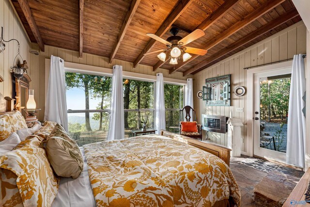 bedroom featuring ceiling fan, lofted ceiling with beams, access to exterior, and wooden ceiling