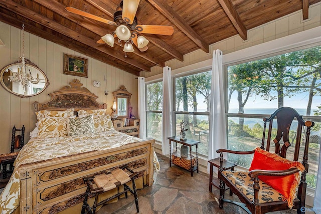 bedroom with wood ceiling, wooden walls, and vaulted ceiling with beams