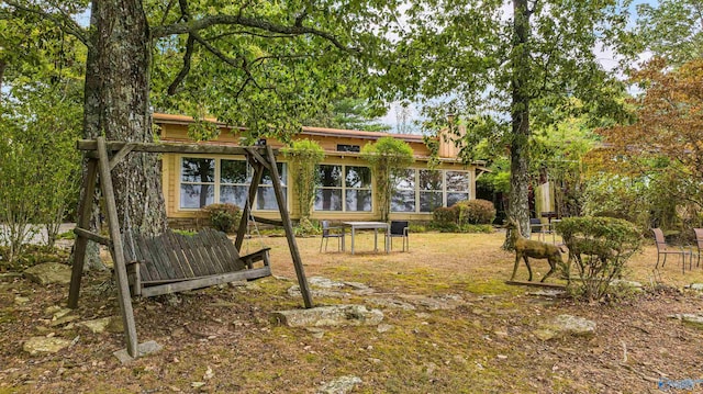 view of yard featuring a sunroom