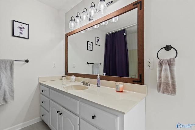 bathroom featuring vanity and baseboards