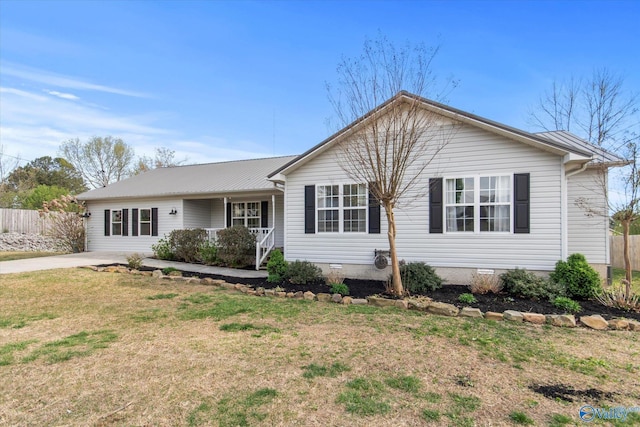ranch-style home with a porch, crawl space, fence, and a front lawn
