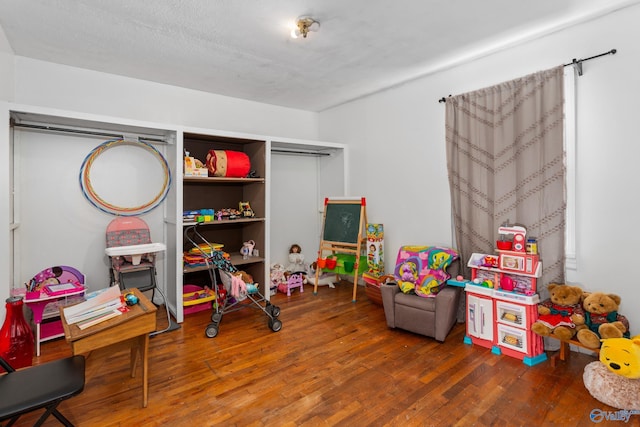 playroom with hardwood / wood-style flooring