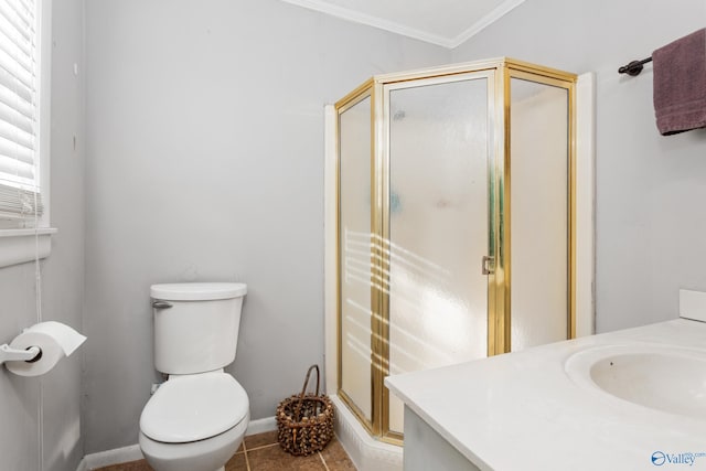 full bathroom with tile patterned flooring, crown molding, toilet, a stall shower, and vanity