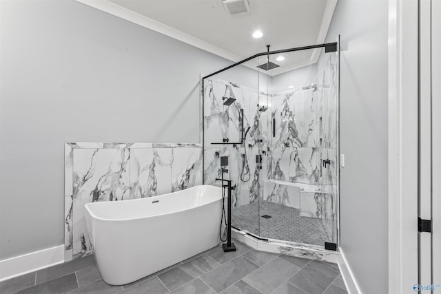 bathroom featuring ornamental molding, visible vents, a freestanding bath, and a marble finish shower