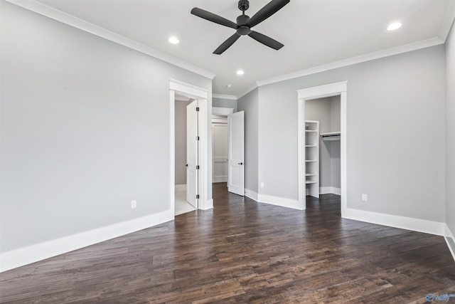 unfurnished bedroom with dark wood-type flooring, recessed lighting, a spacious closet, and baseboards