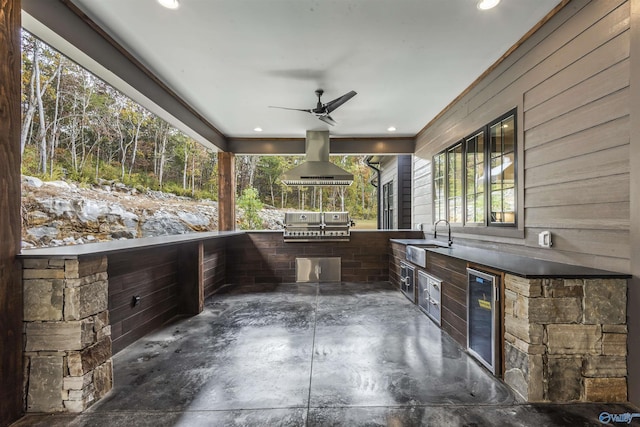 view of patio with a ceiling fan, area for grilling, wine cooler, a grill, and a sink